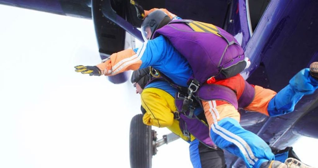 Neil Martin and his instructor leaving the plane door