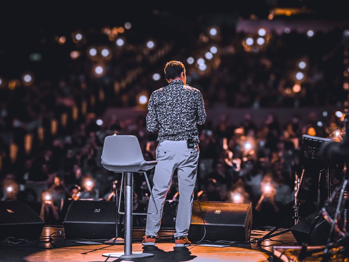 Speaker on stage seen from behind